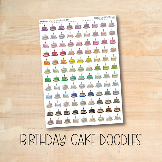 a birthday cake doodles sticker on a wooden table