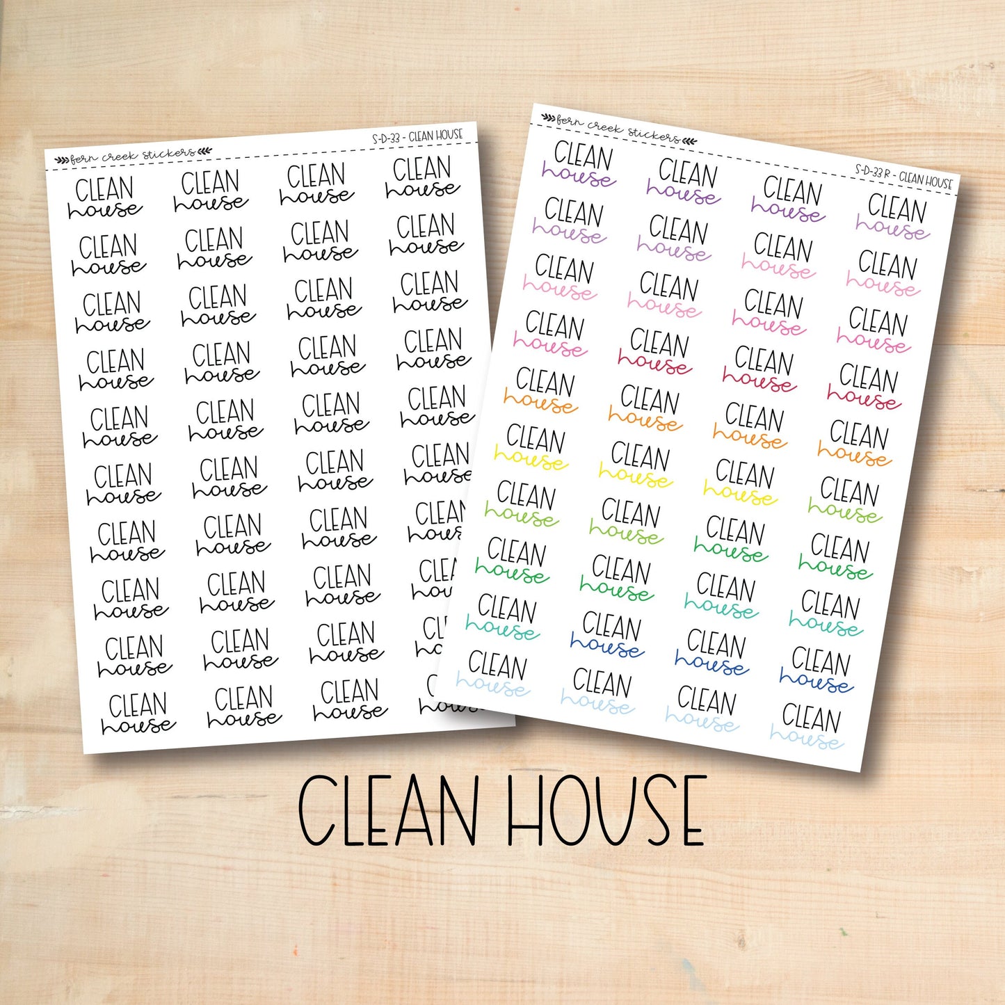 two clean house stickers on a wooden surface