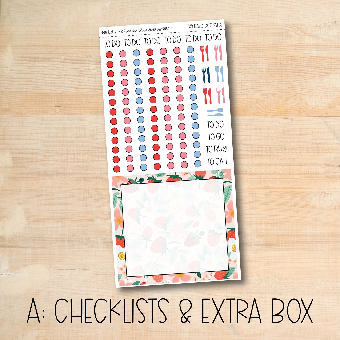 a checklist and extra box of stickers on a wooden surface