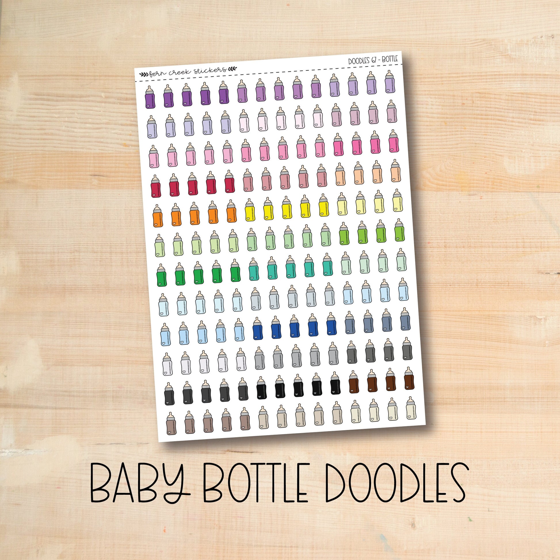 a baby bottle doodles sticker on a wooden surface