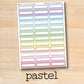 a pastel planner sticker on a wooden surface