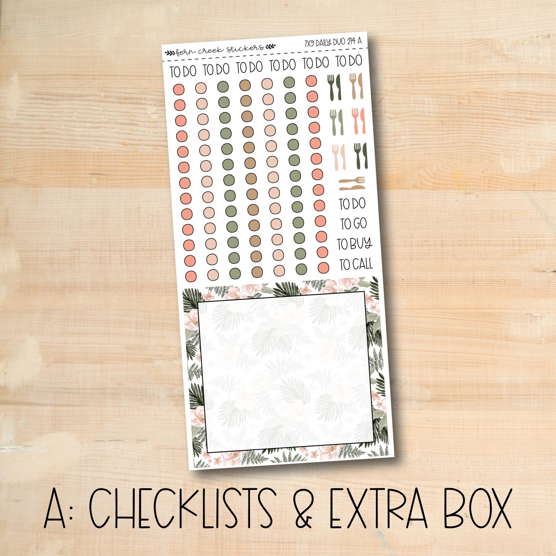 a checklist and extra box of stickers on a wooden surface