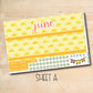 a yellow and white paper with the word june on it