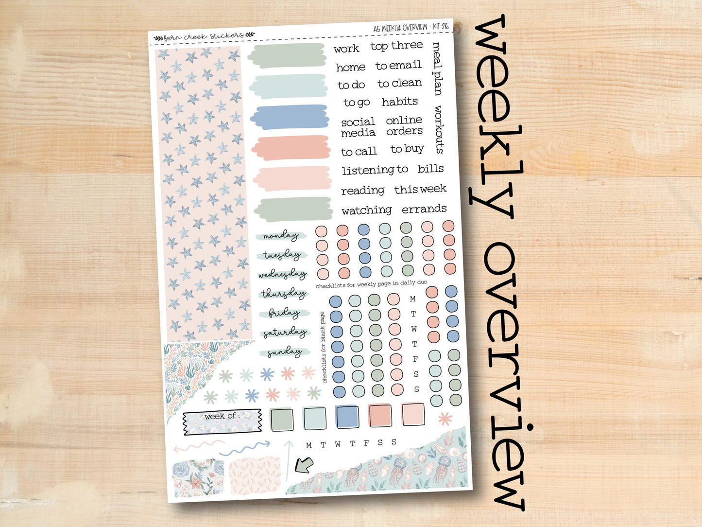 a close up of a sticker sheet with a wooden background