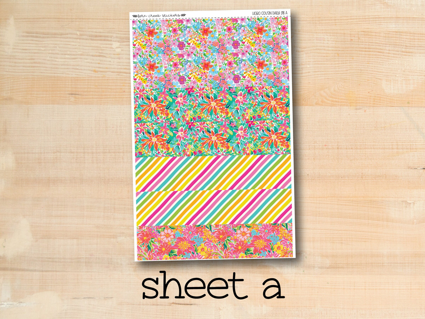 a sheet of paper with flowers and stripes on it