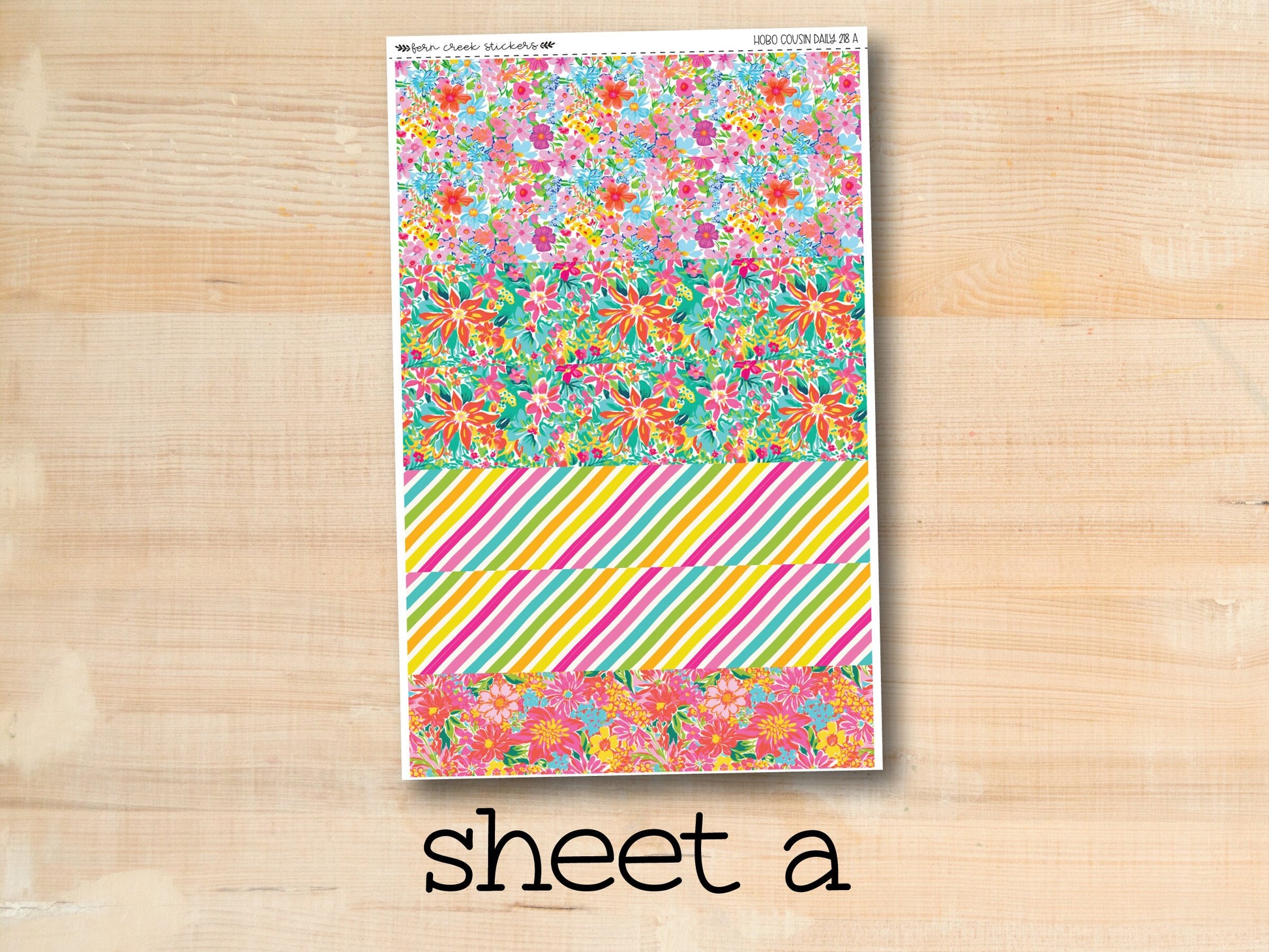 a sheet of paper with flowers and stripes on it