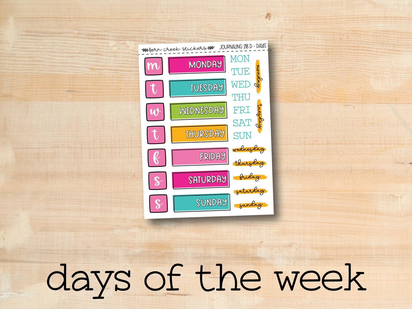 the days of the week sticker on a wooden surface