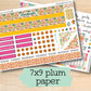 a variety of planner stickers on a wooden surface