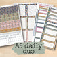 a5 daily planner stickers with a wooden background