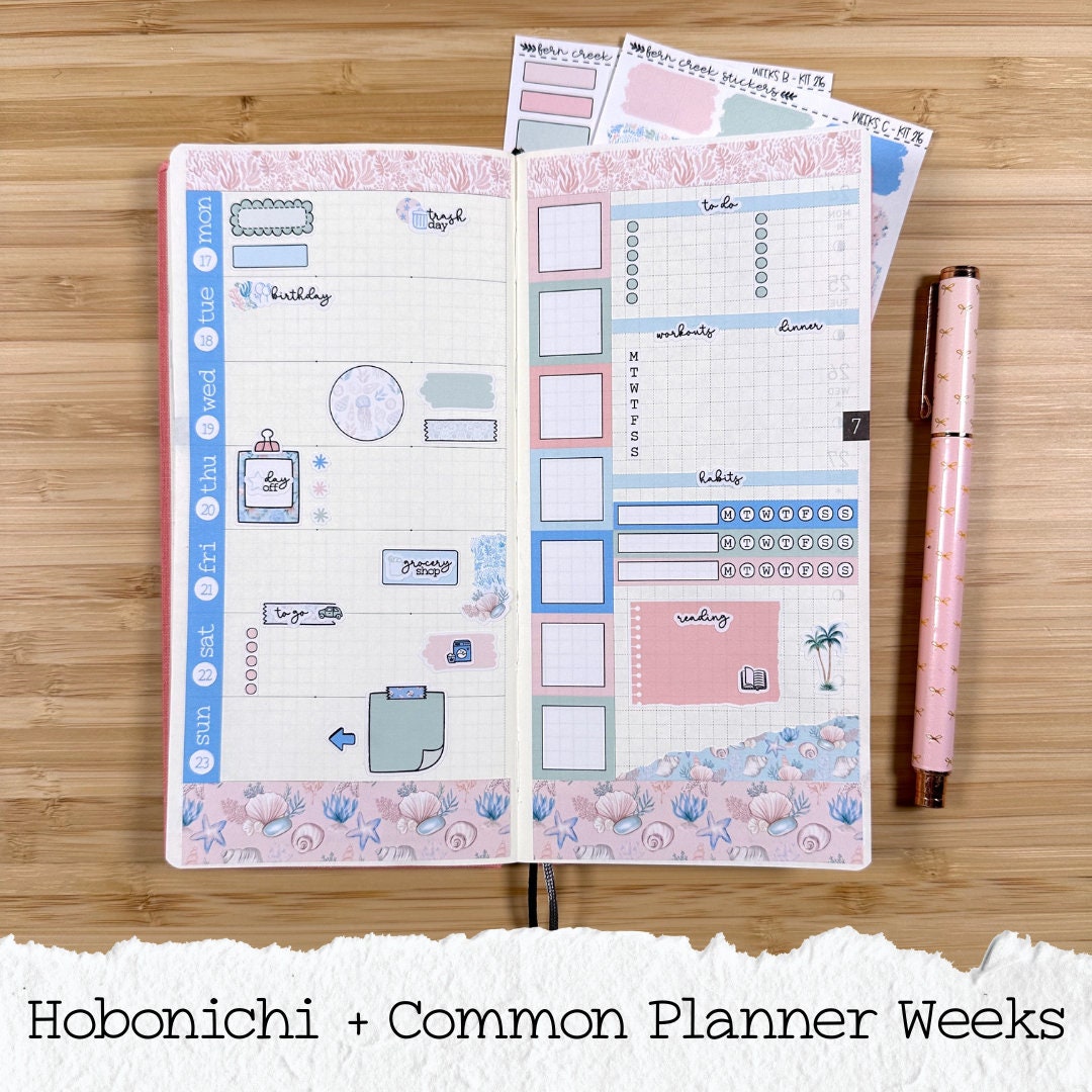 a planner with a pen on top of it