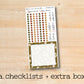 a checklist and extra box on a wooden surface