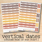 two stickers of vertical dates on a wooden surface