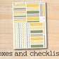 a close up of a sticker with the words boxes and checklists on it