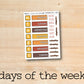 the days of the week sticker on a wooden surface