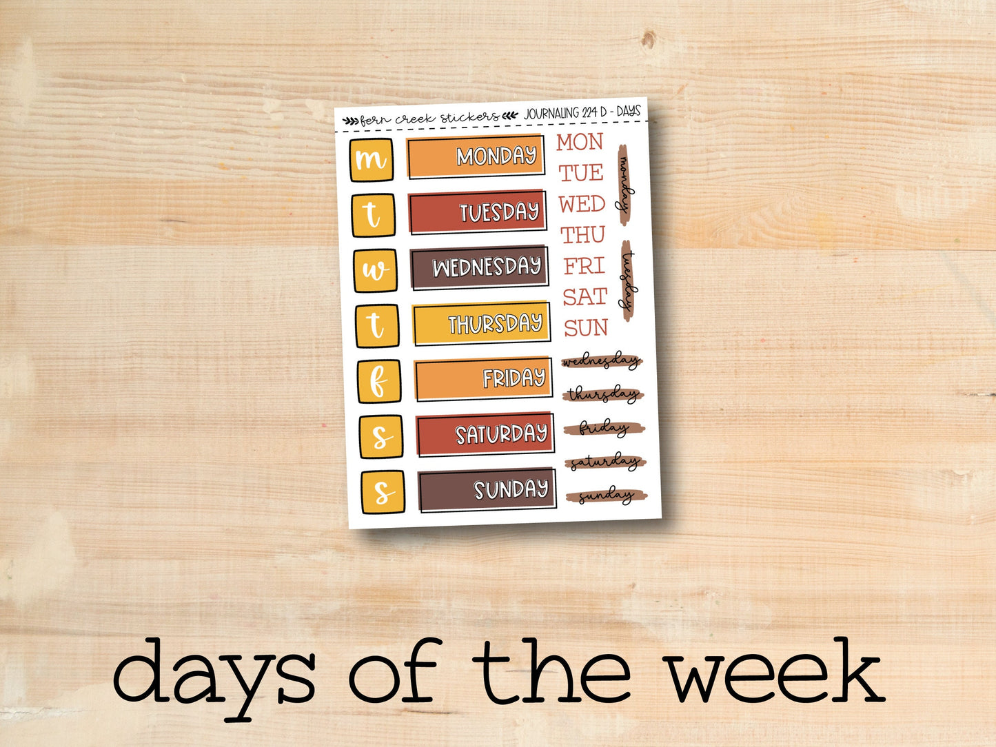 the days of the week sticker on a wooden surface