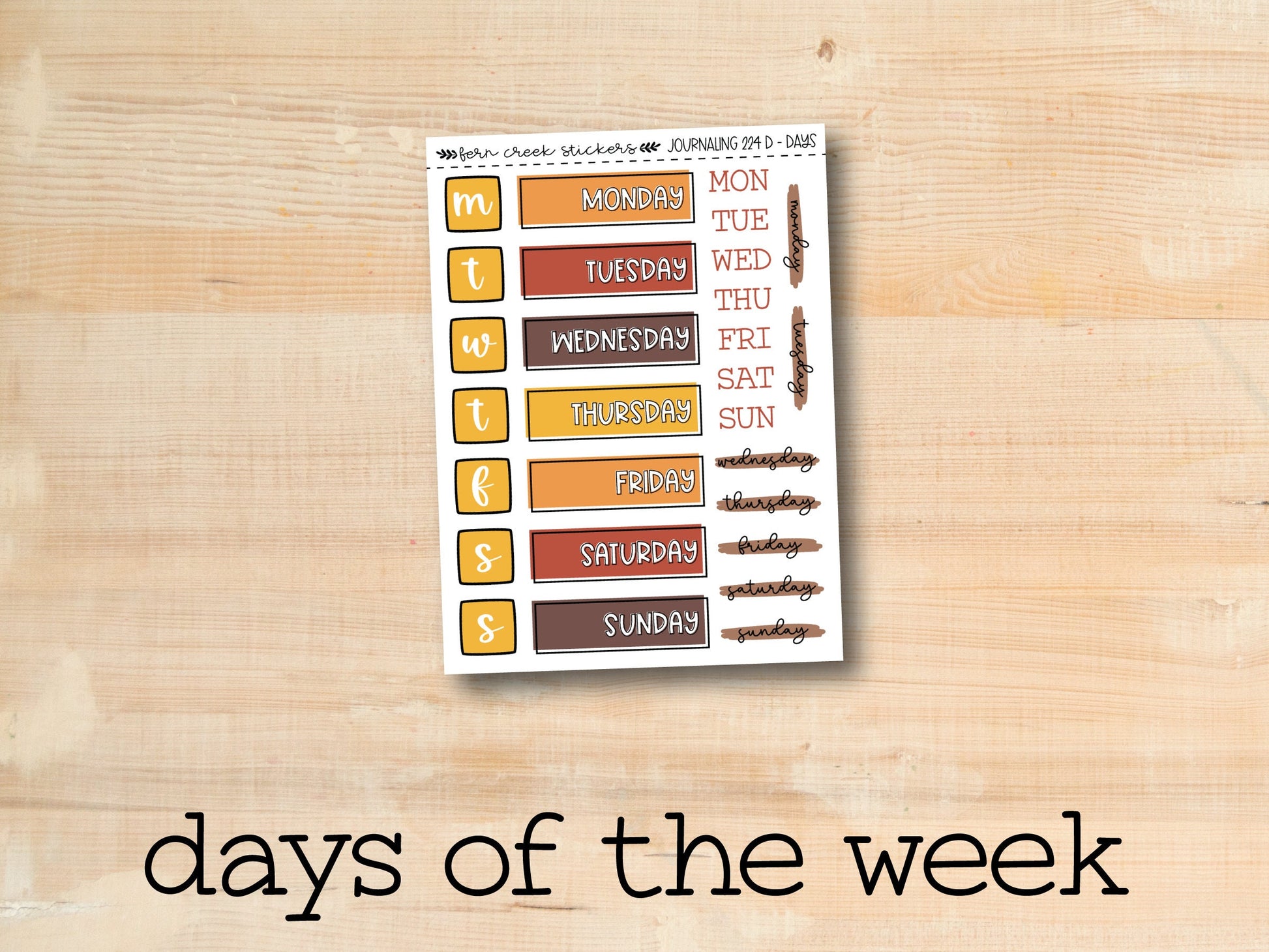 the days of the week sticker on a wooden surface