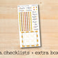 a checklist and extra box with a wooden background