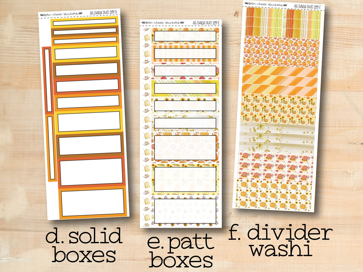 three different types of divider boxes on a wooden surface