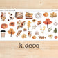 a wooden table topped with lots of fall decorations