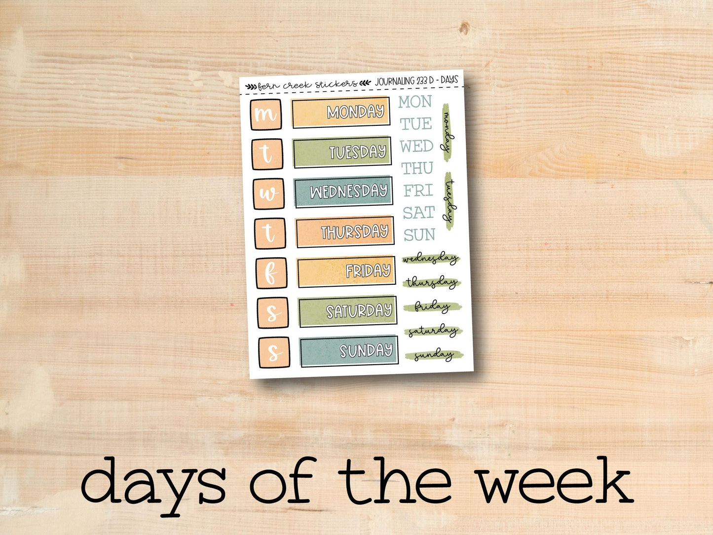 the days of the week sticker on a wooden surface