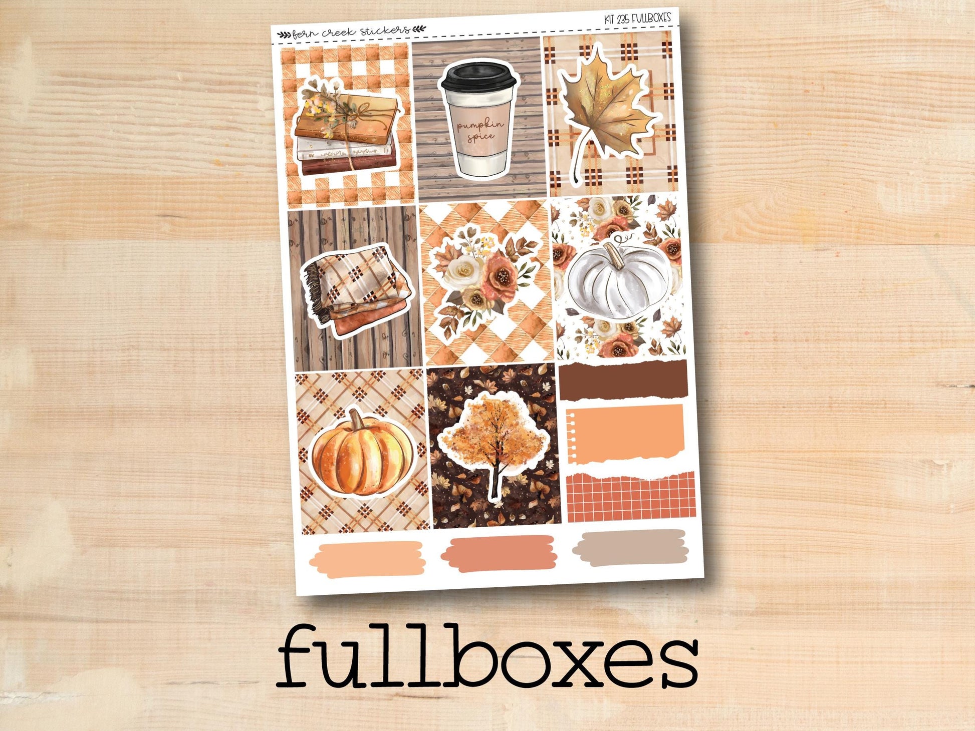 a sticker of fall boxes on a wooden surface