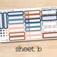 a sheet of stickers with a wooden background