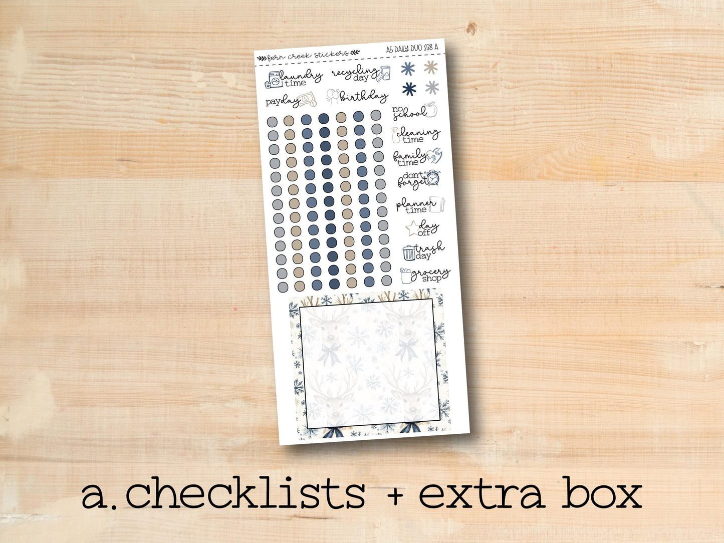 a checklist and extra box of stickers on a wooden surface