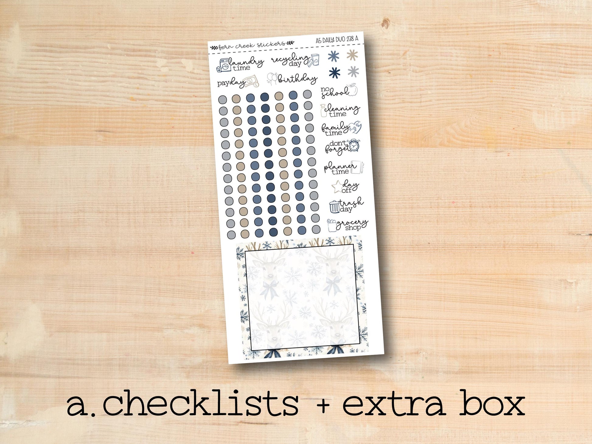 a checklist and extra box of stickers on a wooden surface