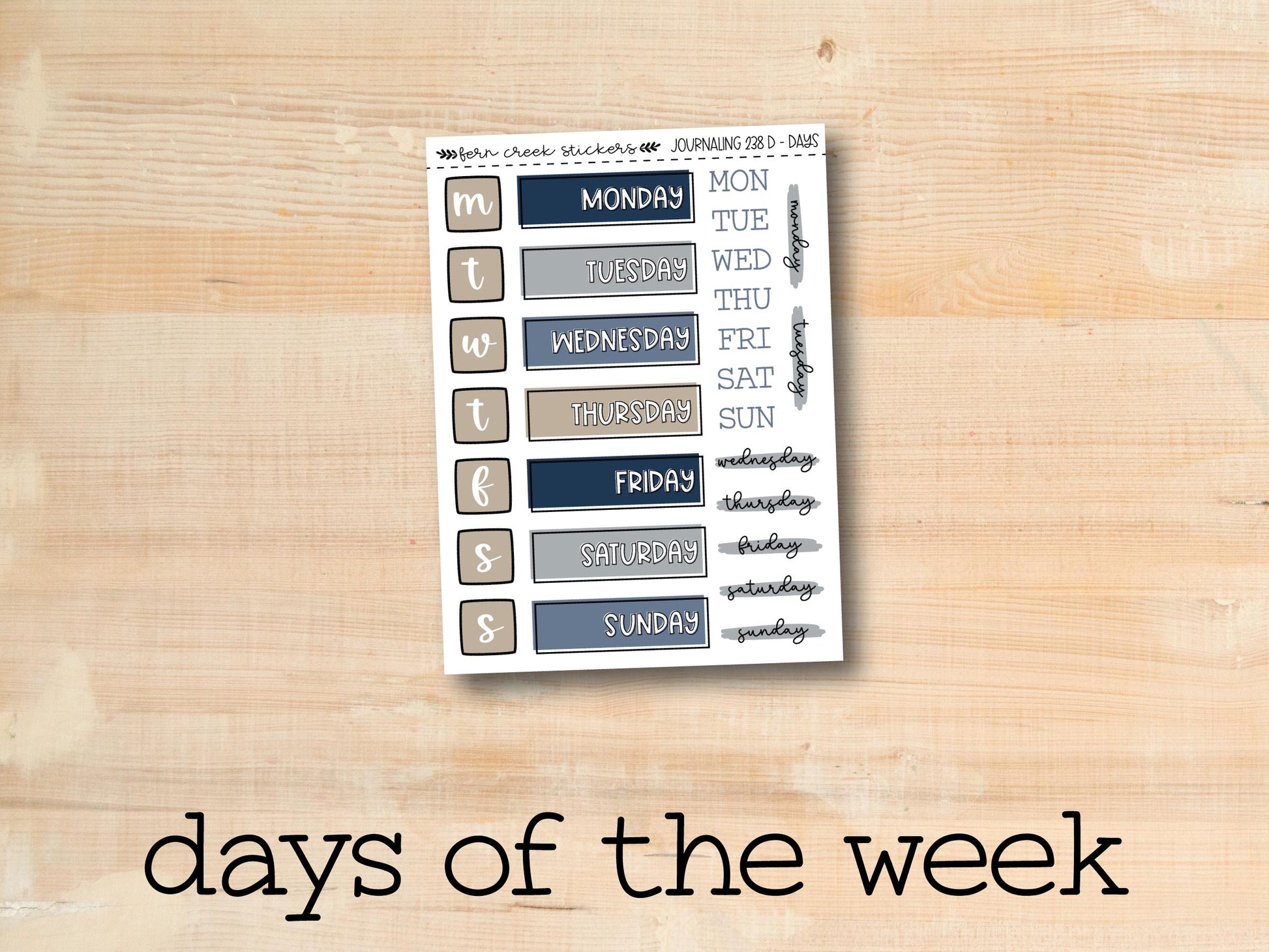 the days of the week stickers are displayed on a wooden surface