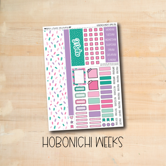 the hobonichi weeks sticker sheet is displayed on a wooden surface