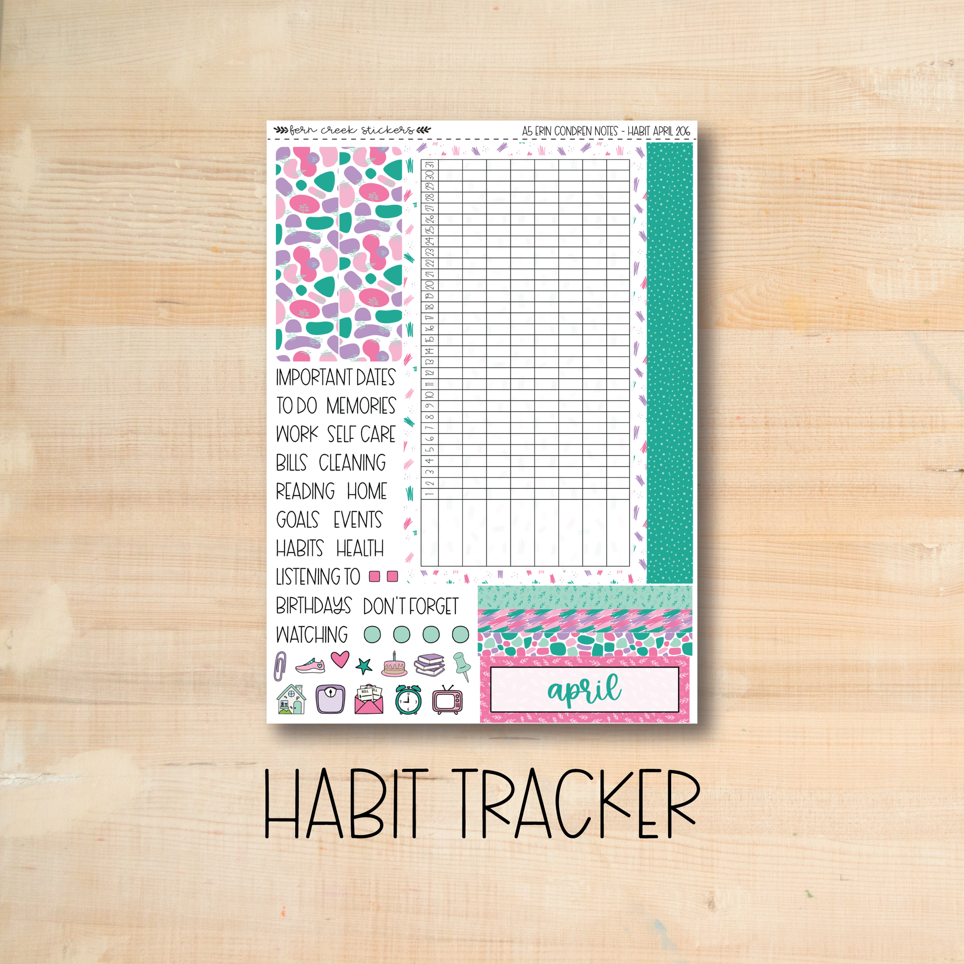 the habit tracker sticker is shown on a wooden surface