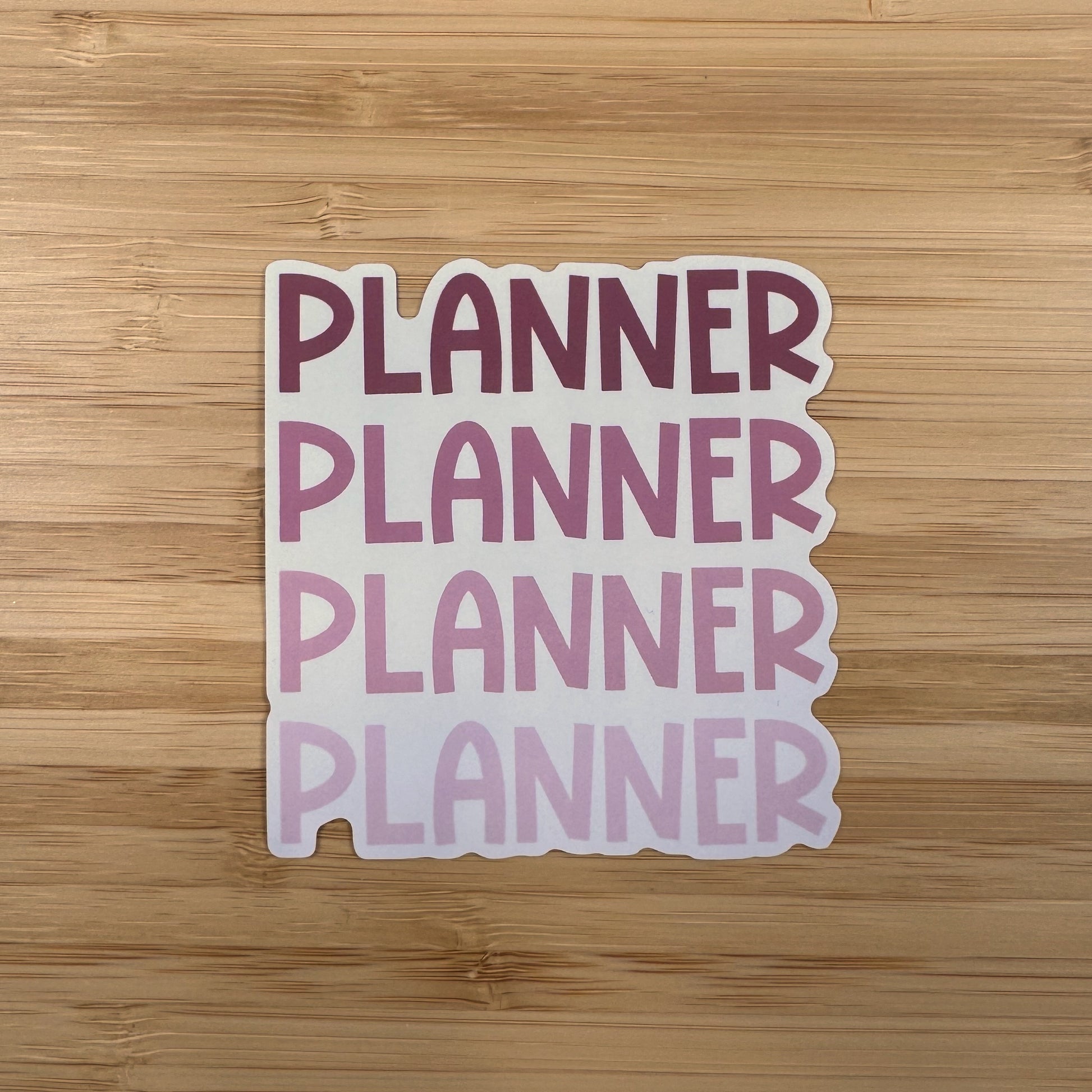 a planner sticker on a wooden surface