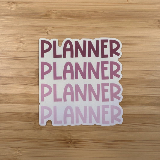 a planner sticker on a wooden surface