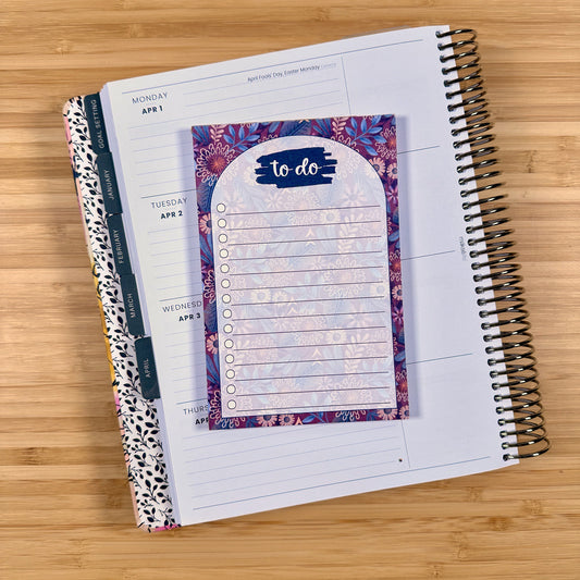a notebook with a to do list on it