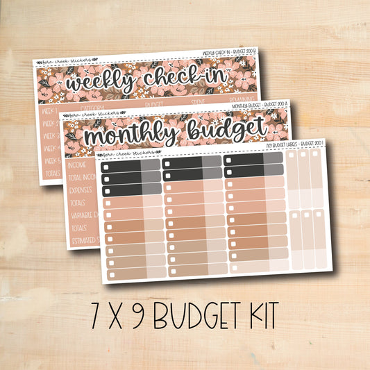 a wooden table topped with three planner stickers