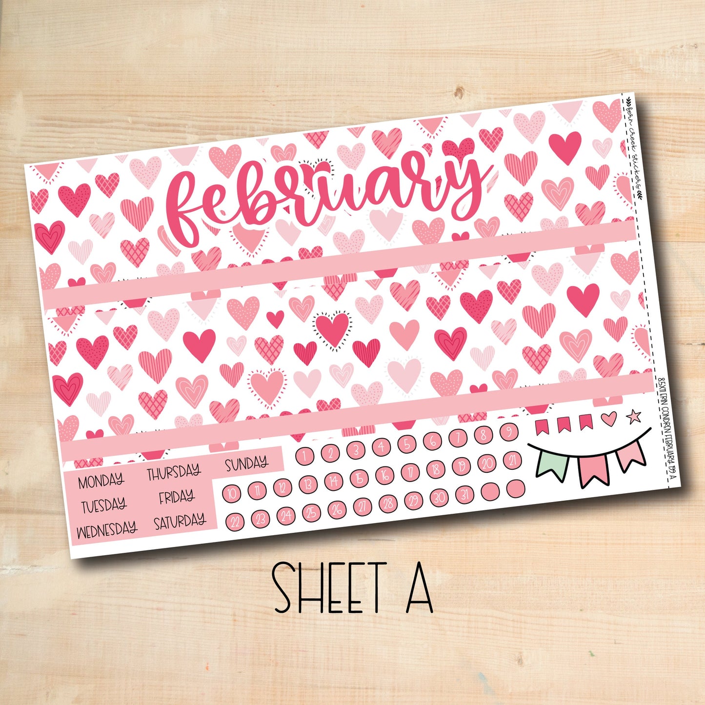 a pink and red valentine&#39;s day planner with hearts