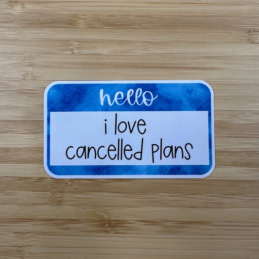 a wooden table with a sign that says hello i love called plans