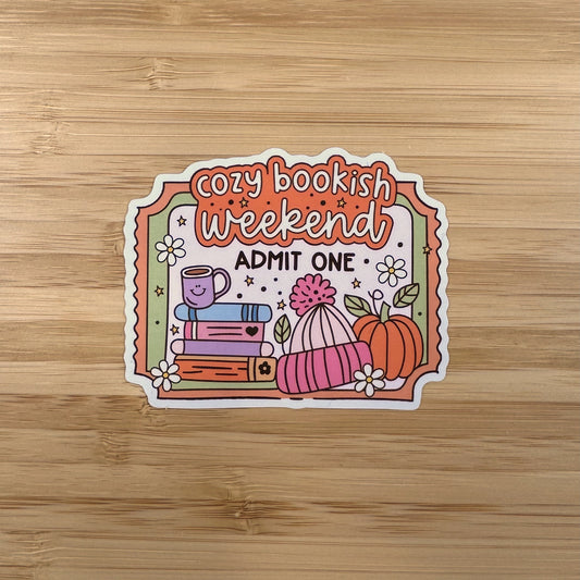 a sticker with a picture of books and pumpkins