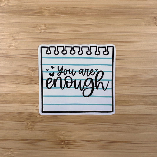a notepad with the words you are enough written on it