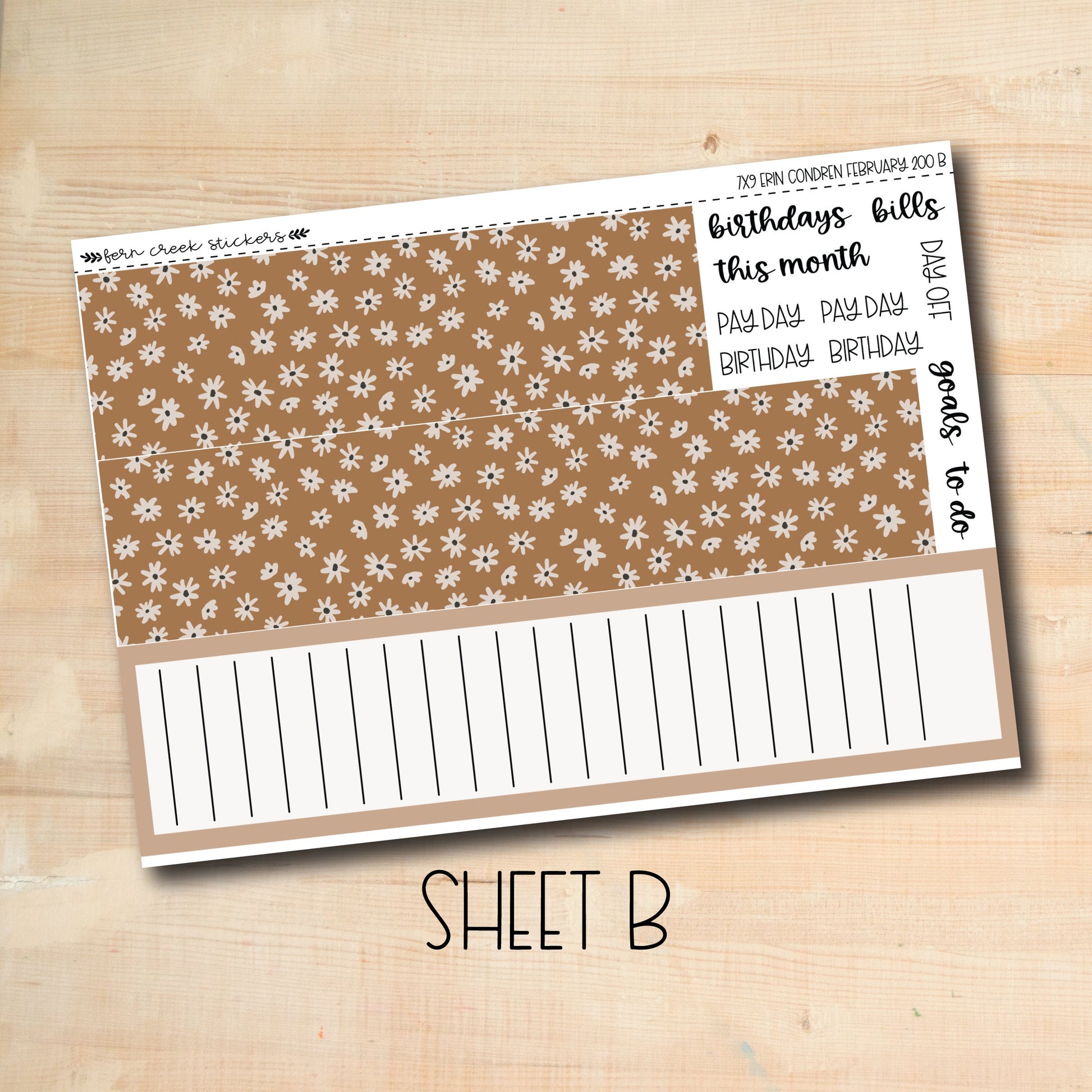 a sheet of brown paper with white flowers on it