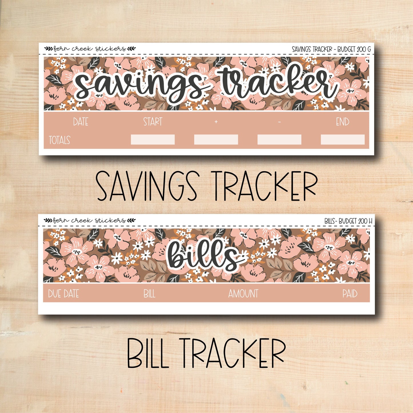 a picture of two savings tracker labels on a wooden surface