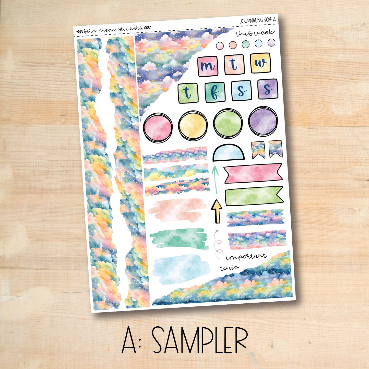 a sample of watercolor stickers on a wooden surface