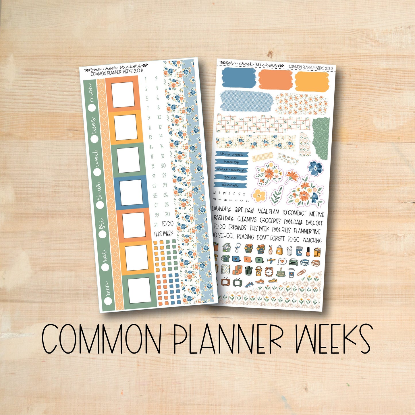 a wooden table topped with two planner stickers