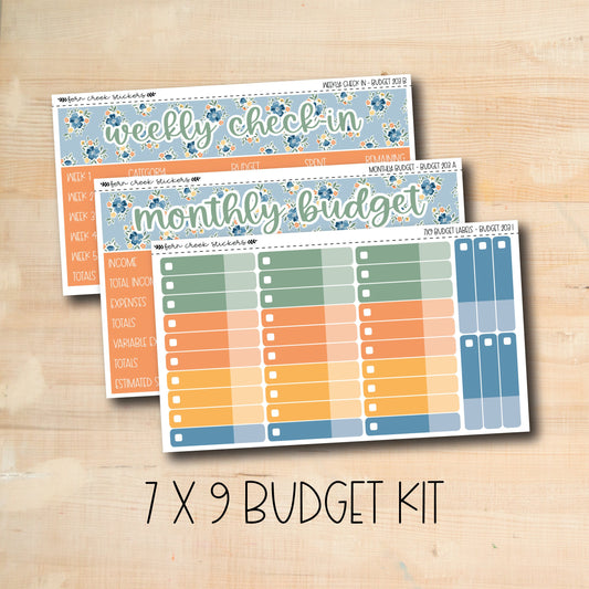 a wooden table topped with three planner stickers