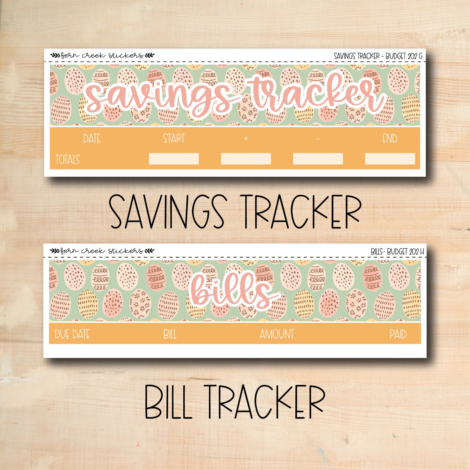 two coupons for savings tracker on a wooden table
