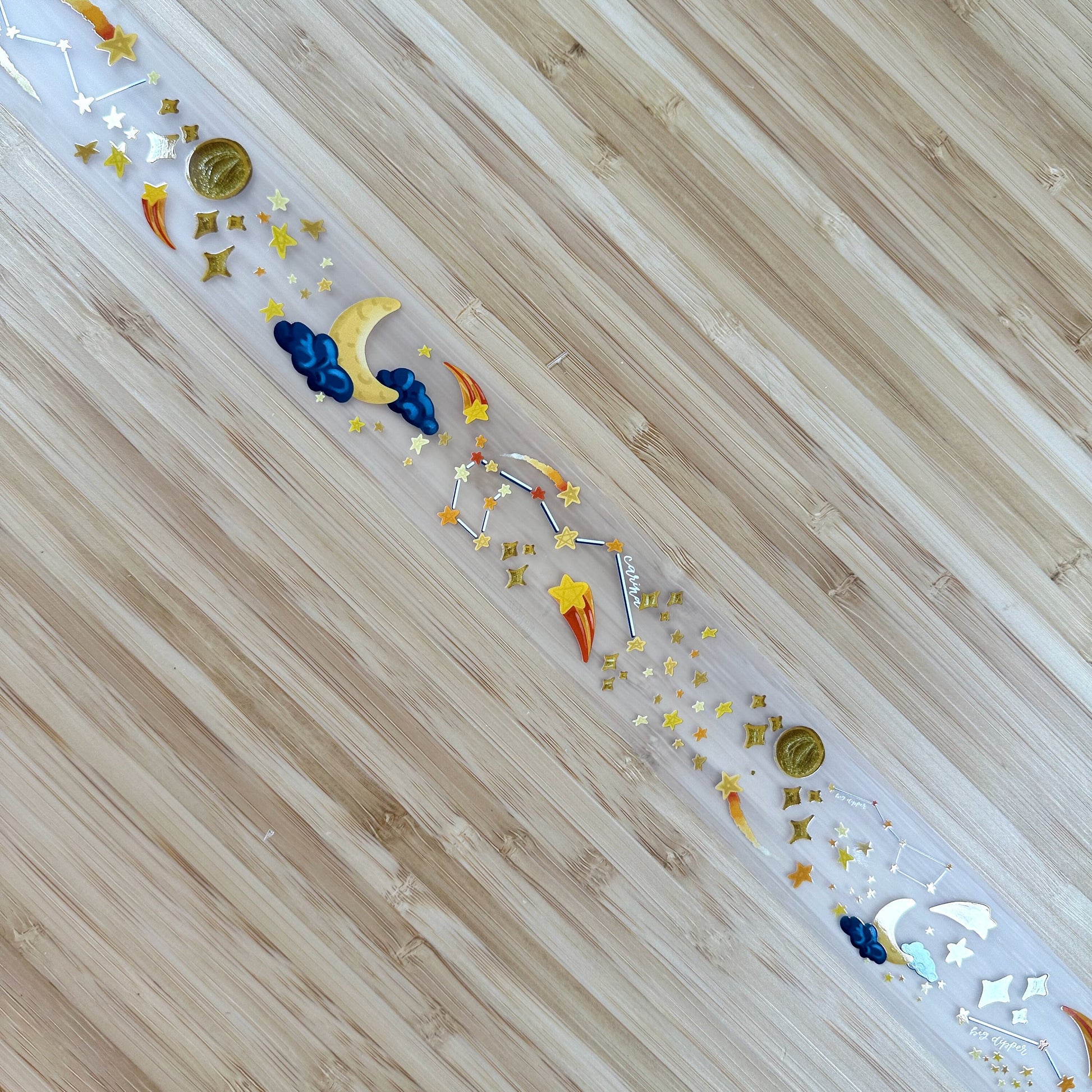 a wooden floor with stars and confetti on it