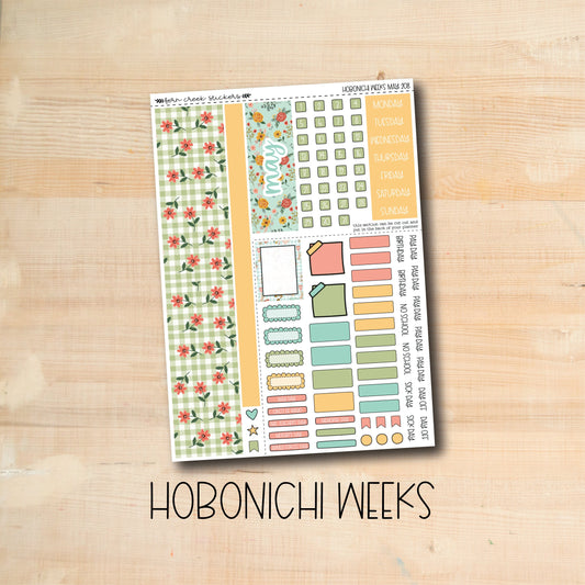 the hobonichi weeks stickers are on a wooden surface