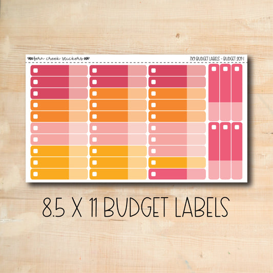 a pink and orange planner sticker on a wooden surface