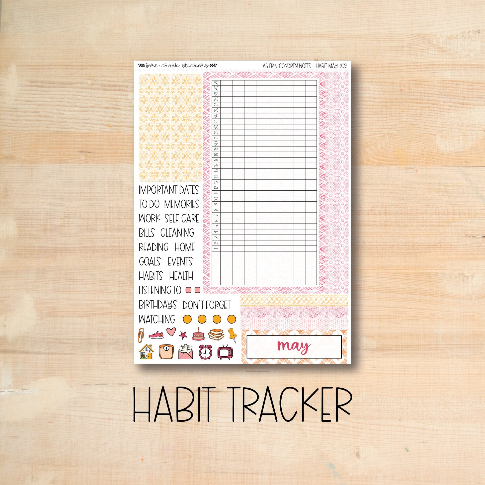 the habit tracker sticker is shown on a wooden surface