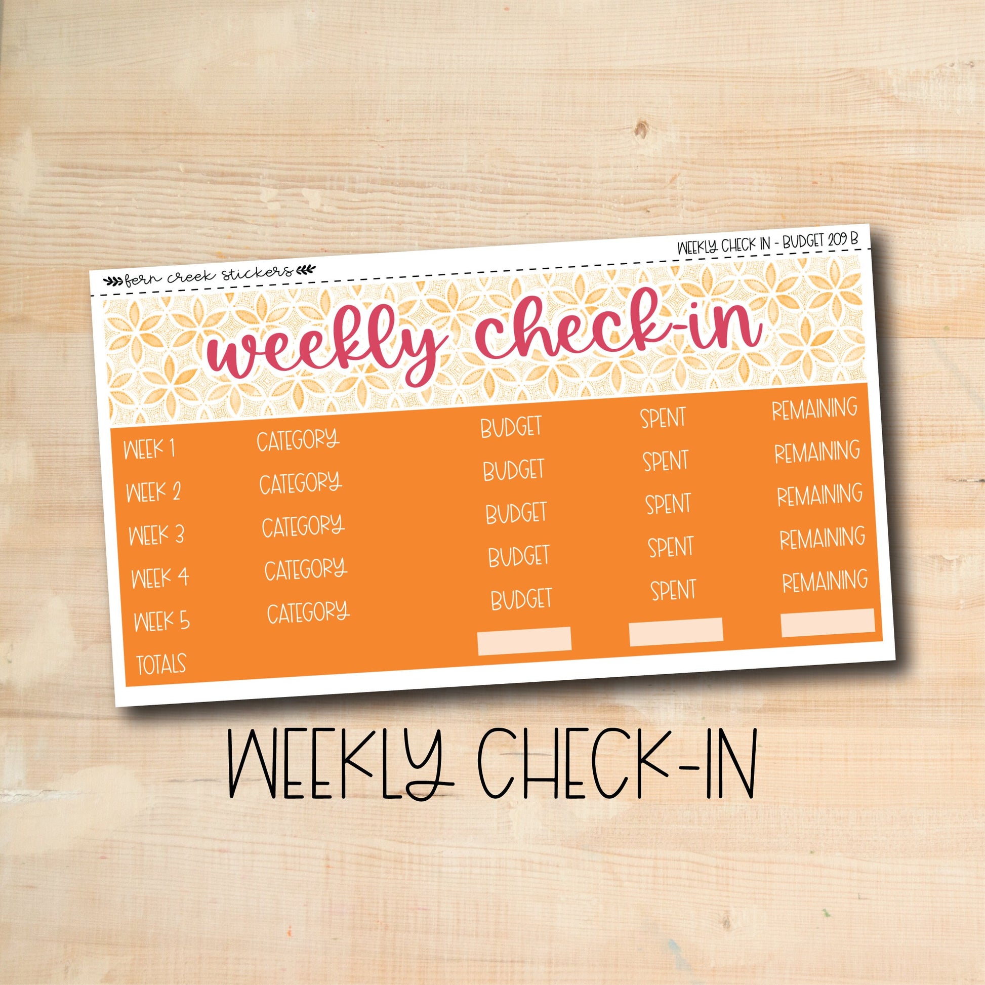 a wooden table topped with a yellow and orange weekly check - in